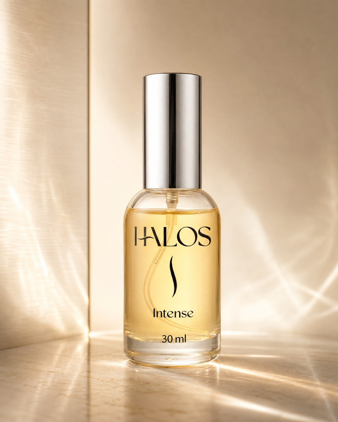 Flacone di Halos Intense da 30 ml illuminato da riflessi dorati